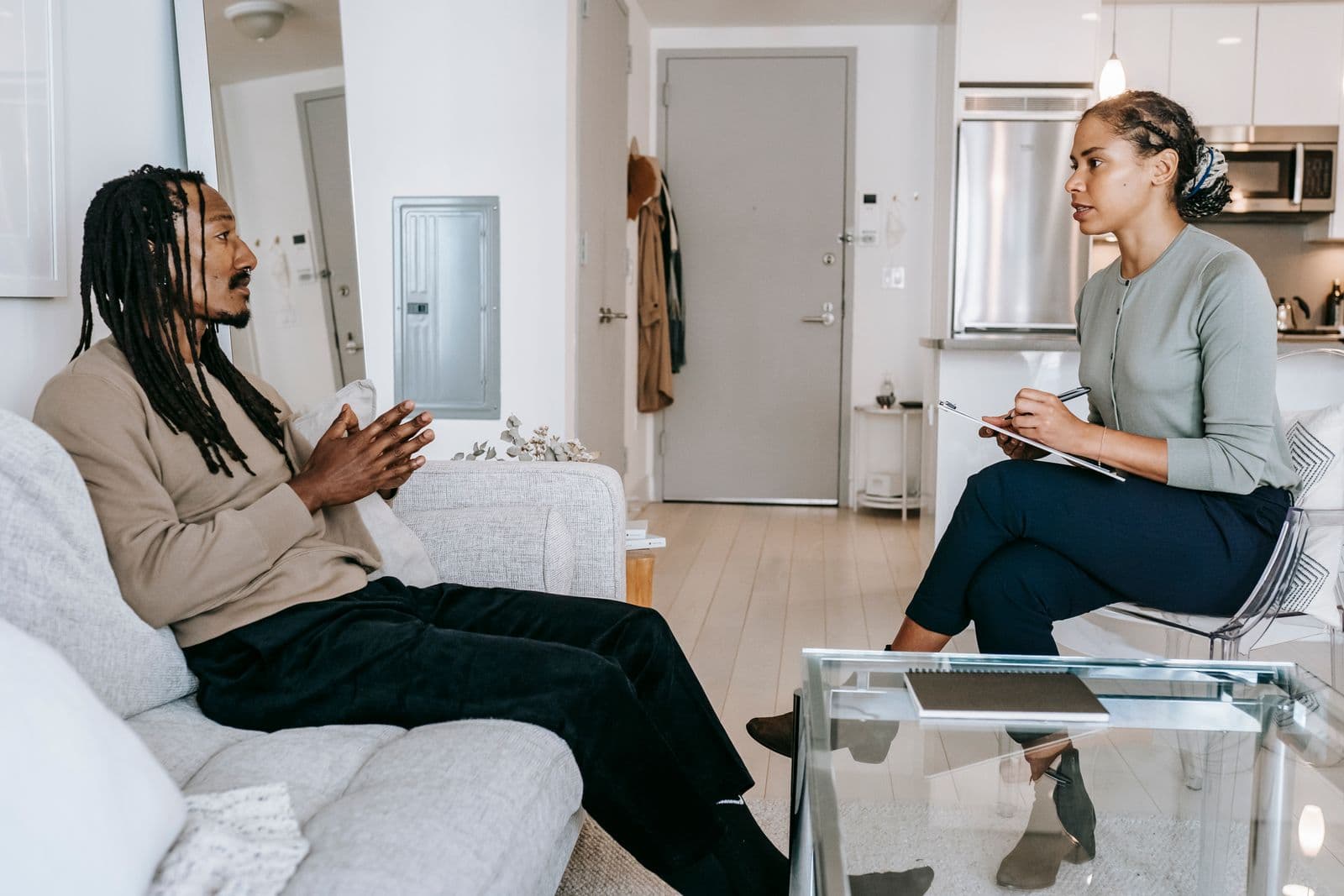 A man talking with a counsellor in a bright, calm room